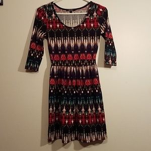 Multi color dress with quarter length sleeves.